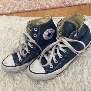 Navy women’s high top chuck taylors